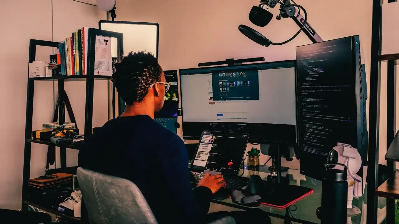 A developer from Mjini Digital coding an application on a wide screen | Website Developers in Nairobi